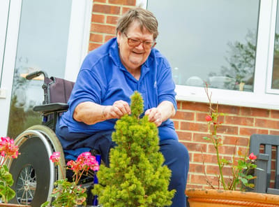 Resident gardening on the patio