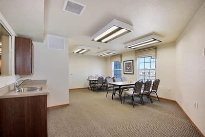 Bright activity room with tables and chairs