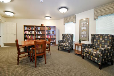 Common area with bookshelves and seating