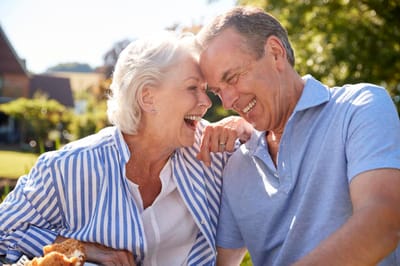 Happy residents enjoying food outdoors