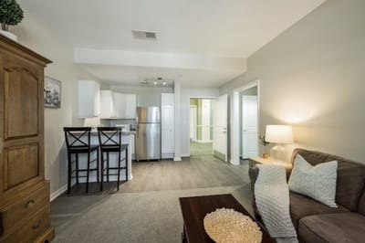 Interior view of a resident unit with kitchen and living area