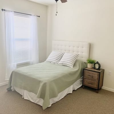 Cozy private bedroom with a neatly made bed