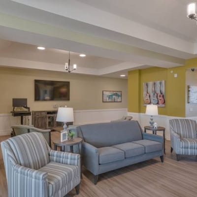 Bright common area with comfortable seating and decor