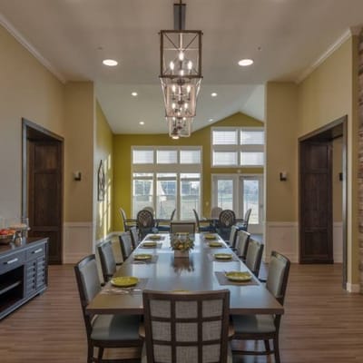 Bright dining room with a long table and chairs
