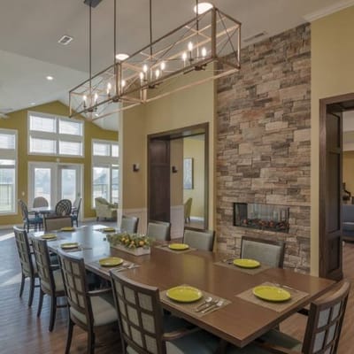 Dining room with a large wooden table and modern decor