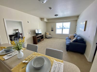 Cozy living area of a resident room with furniture