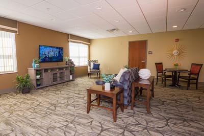 Bright common area with seating and television