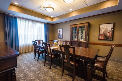 Common area dining space with wood furniture