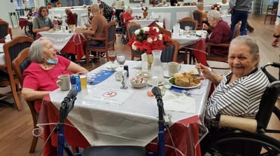 Residents enjoying a meal in the dining room