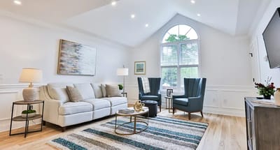 Bright common area with comfortable seating and decor