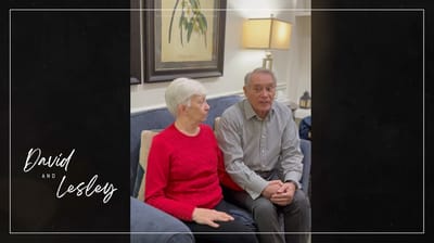 Two residents sitting together in a common area