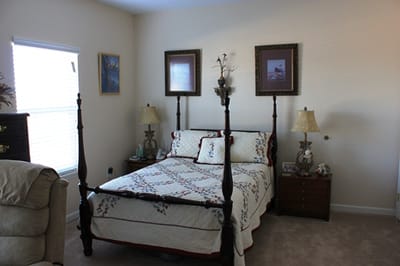 Cozy bedroom setup with floral bedding and decor