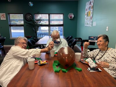 Residents enjoying a game day celebration with snacks