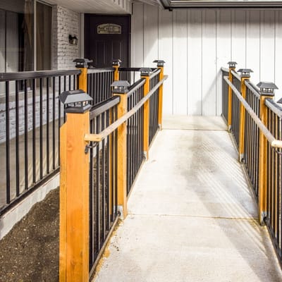 Front entrance with accessible handrails and walkway