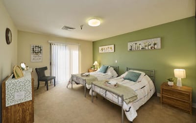Cozy interior of a resident room with twin beds