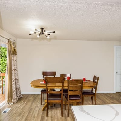 Dining area with wooden table and chairs