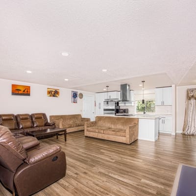Bright interior common area with seating and kitchen