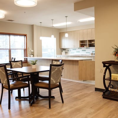 Bright common area with kitchen and dining table
