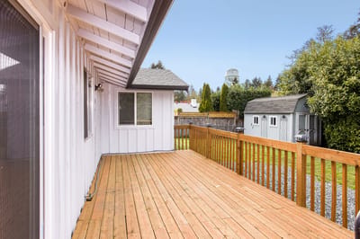Wooden deck overlooking a green yard