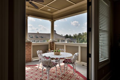 Outdoor patio area with a table and chairs