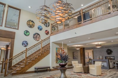 Bright interior of the facility lobby with a staircase