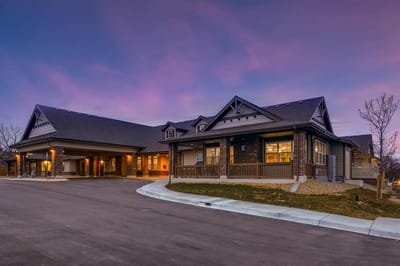 Exterior view of Rocky Mountain Assisted Living facility at sunset