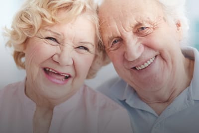 A happy senior couple smiling for the camera