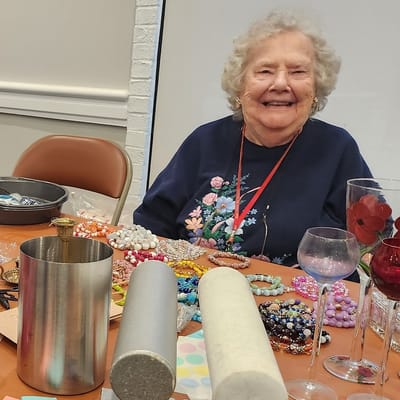 Resident engaged in a craft activity with supplies