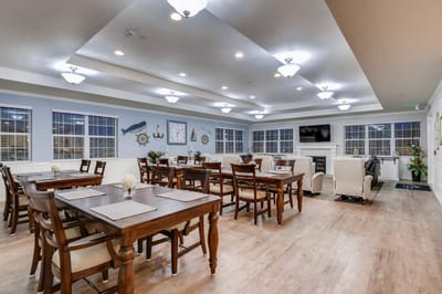 Bright dining area with tables and chairs arranged