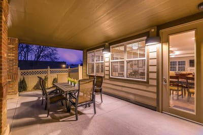 Outdoor seating area with tables and chairs