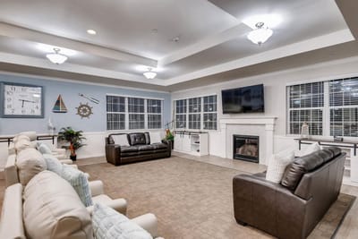 Bright common area with comfortable seating and windows