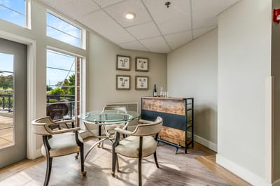 Bright common area with modern furnishings and outdoor view