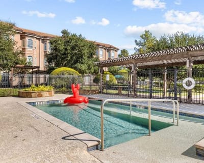 Outdoor pool area with a decorative float