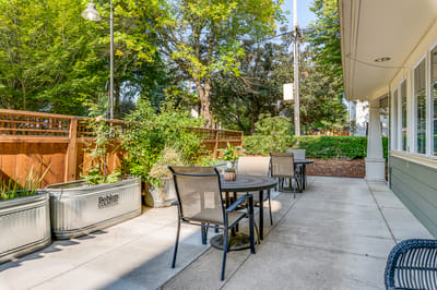 Outdoor seating area with tables and plants