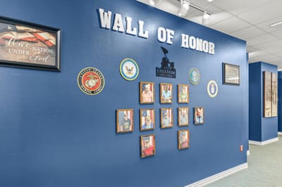 Wall of honor with military service recognition pictures