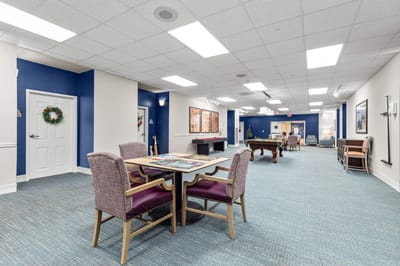Bright common area with seating and games