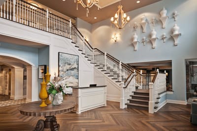 Bright and elegant lobby with decorative staircase