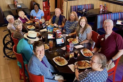 Residents enjoying a meal together in a dining area