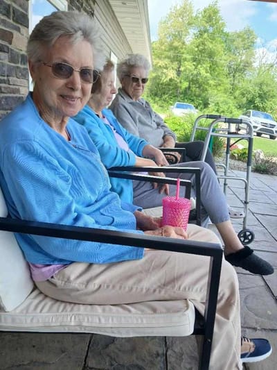 Residents enjoying time outdoors on a patio