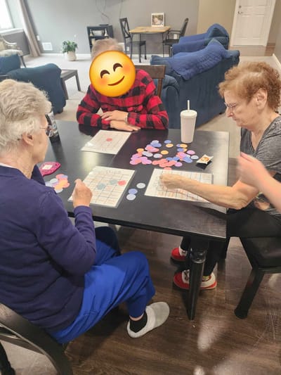 Residents playing a game in a common area