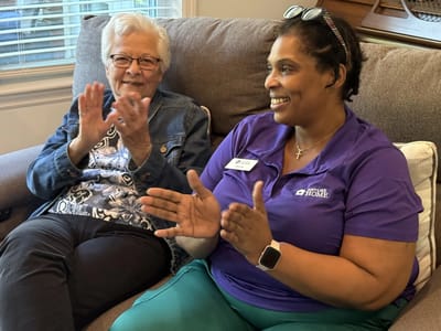 Residents and staff engaging in an activity
