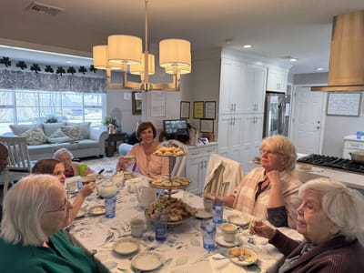 Residents enjoying a social gathering with snacks