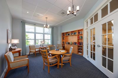Comfortable common area with seating and bookshelves
