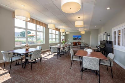 Bright common area with tables and seating