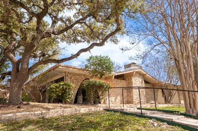 Exterior view of the assisted living facility with landscaping