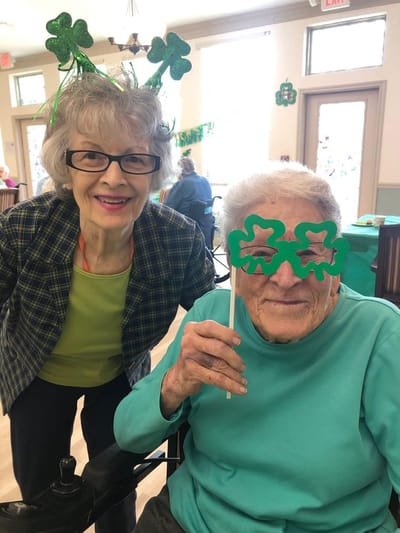 Residents celebrating with festive decorations and hats