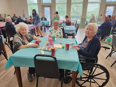Residents enjoying an activity in a bright common area