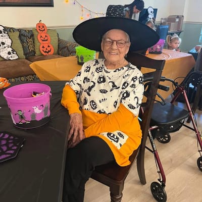 Resident participating in a Halloween celebration with decorations