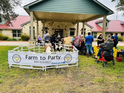 Residents enjoying an outdoor activity with animals
