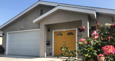 Exterior view of a residential facility with flowers